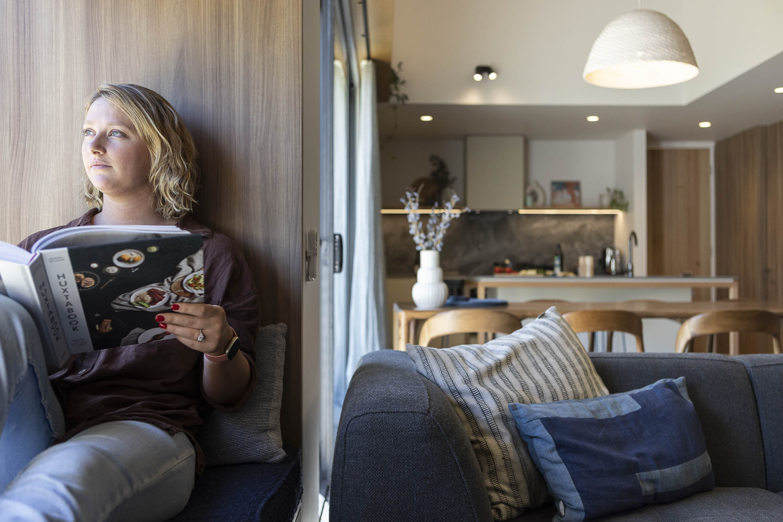 girl sitting reading in windowseat